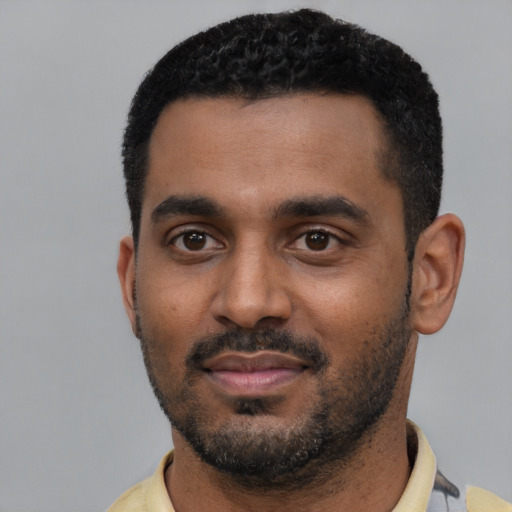 Neutral black young-adult male with short  black hair and brown eyes