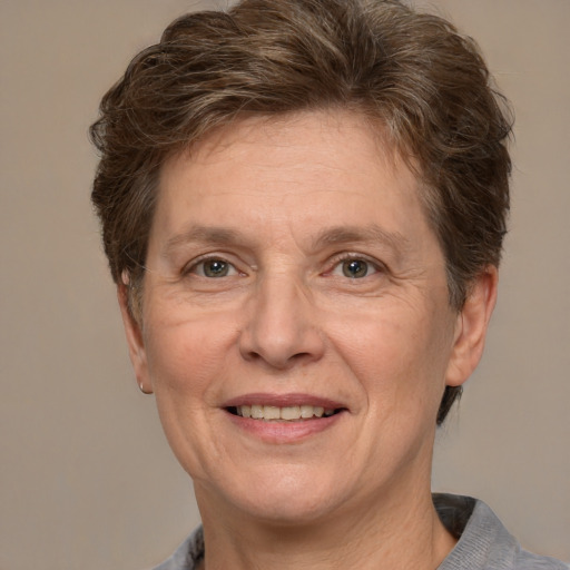 Joyful white middle-aged female with short  brown hair and grey eyes