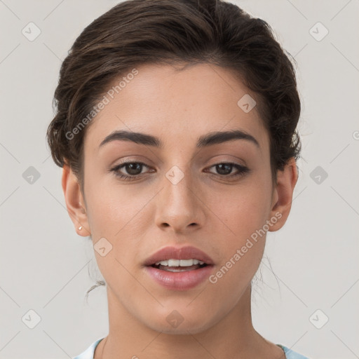 Joyful white young-adult female with short  brown hair and brown eyes