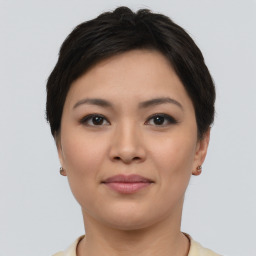 Joyful asian young-adult female with short  brown hair and brown eyes