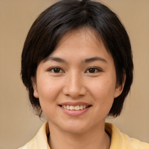 Joyful white young-adult female with medium  brown hair and brown eyes