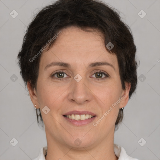 Joyful white adult female with short  brown hair and brown eyes