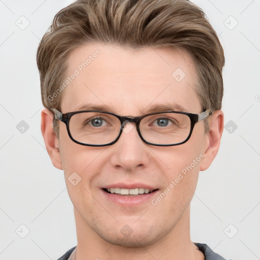 Joyful white adult male with short  brown hair and grey eyes