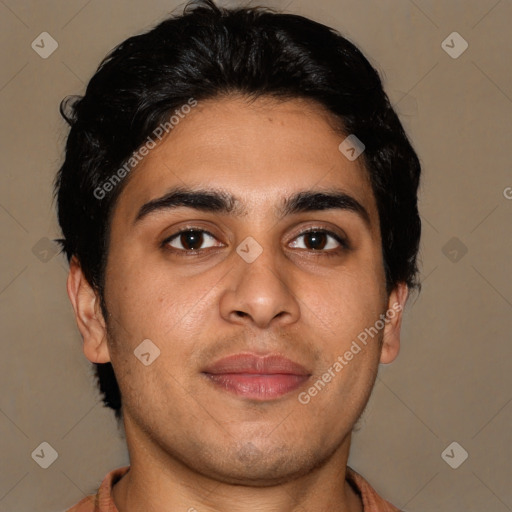 Joyful latino young-adult male with short  brown hair and brown eyes