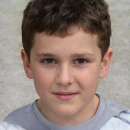 Joyful white child male with short  brown hair and brown eyes