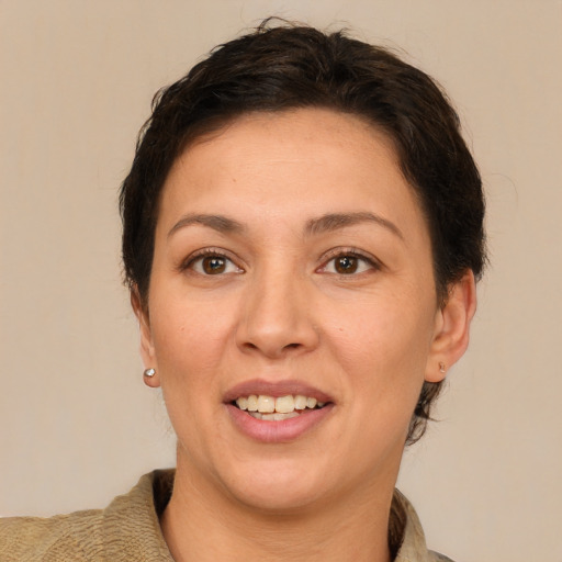 Joyful white adult female with short  brown hair and brown eyes
