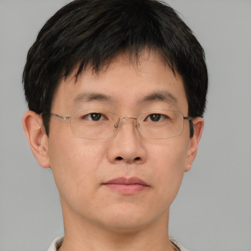 Neutral asian adult male with short  brown hair and brown eyes