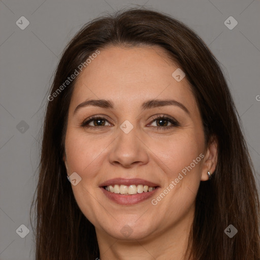 Joyful white young-adult female with long  brown hair and brown eyes