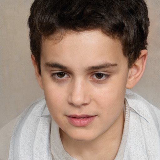 Joyful white child male with short  brown hair and brown eyes