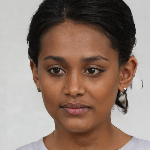 Neutral black young-adult female with short  black hair and brown eyes