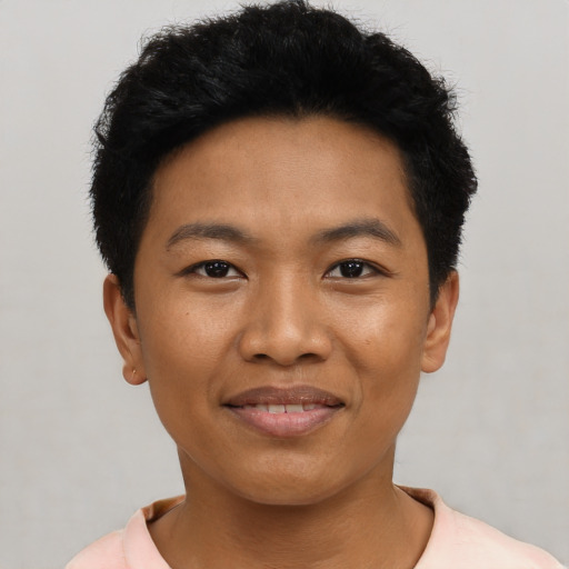 Joyful asian young-adult male with short  black hair and brown eyes