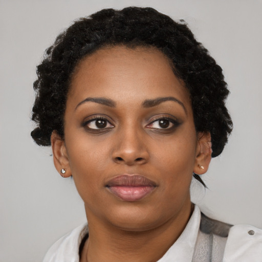 Neutral black young-adult female with short  brown hair and brown eyes