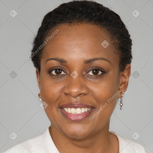 Joyful black young-adult female with short  brown hair and brown eyes