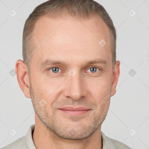 Joyful white adult male with short  brown hair and grey eyes