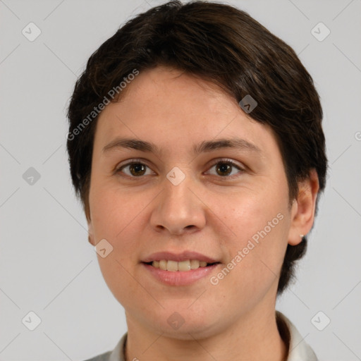 Joyful white young-adult female with short  brown hair and brown eyes