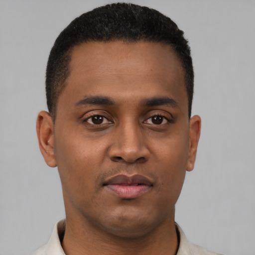 Neutral black young-adult male with short  black hair and brown eyes