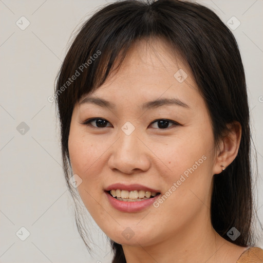 Joyful white young-adult female with medium  brown hair and brown eyes