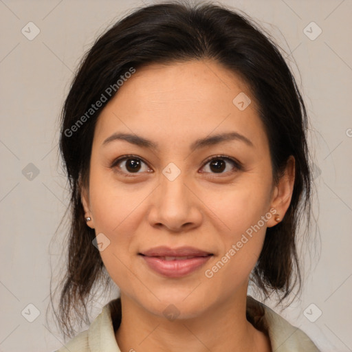 Joyful latino young-adult female with medium  brown hair and brown eyes