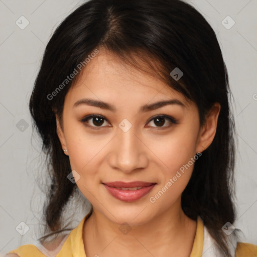 Joyful latino young-adult female with medium  brown hair and brown eyes