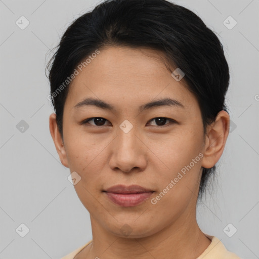 Joyful asian young-adult female with short  brown hair and brown eyes