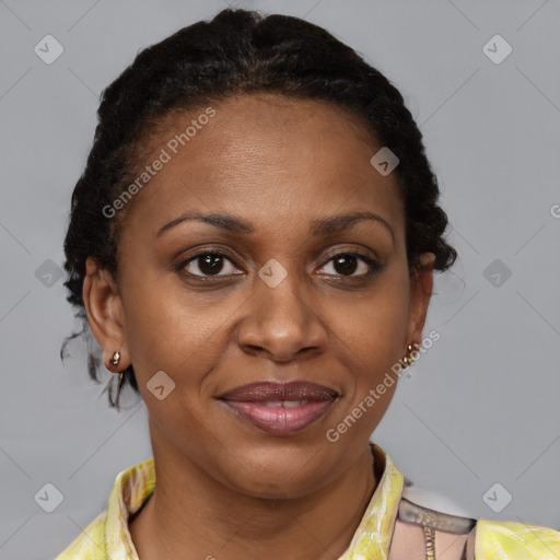 Joyful black adult female with medium  brown hair and brown eyes