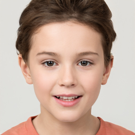 Joyful white child female with short  brown hair and brown eyes