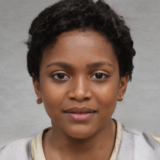 Neutral black child female with short  black hair and brown eyes