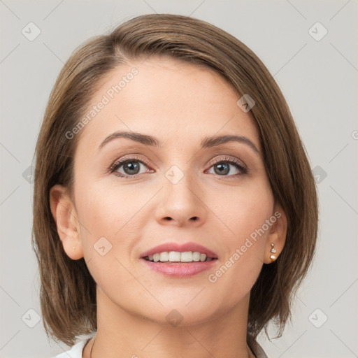 Joyful white young-adult female with medium  brown hair and grey eyes