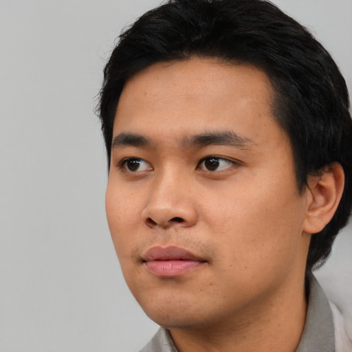 Neutral asian young-adult male with short  black hair and brown eyes
