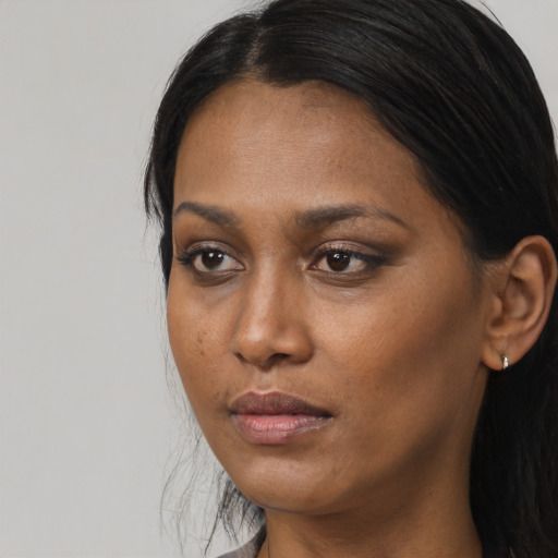 Neutral black young-adult female with long  black hair and brown eyes