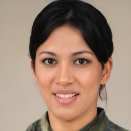 Joyful asian young-adult female with medium  brown hair and brown eyes