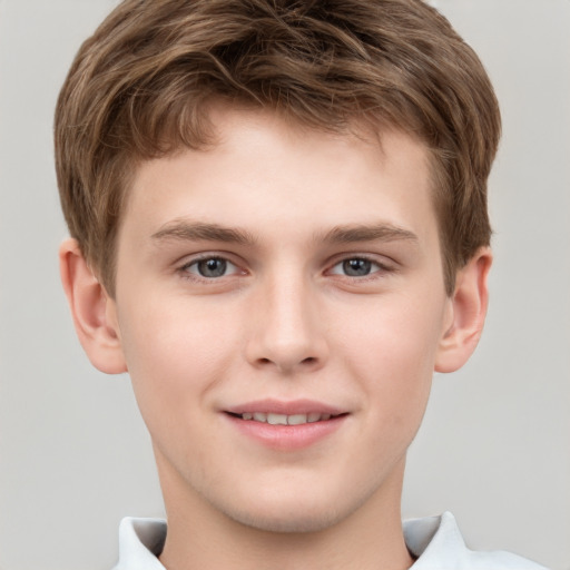 Joyful white child male with short  brown hair and brown eyes