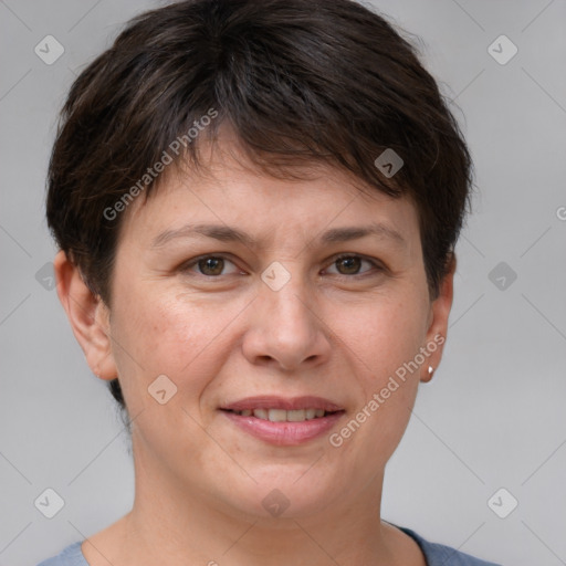 Joyful white adult female with short  brown hair and brown eyes