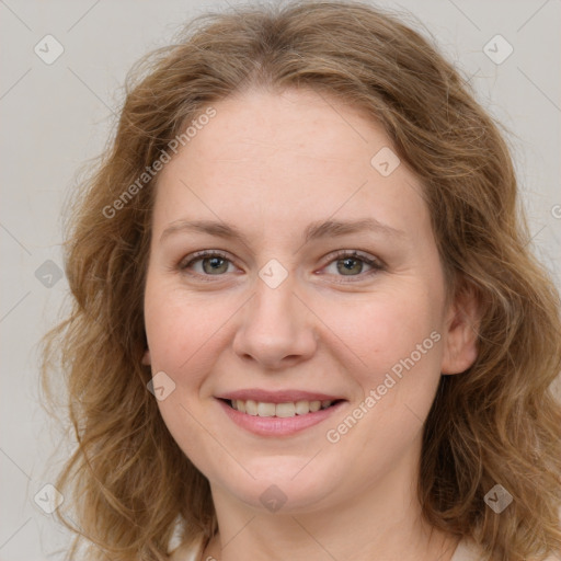 Joyful white young-adult female with long  brown hair and green eyes