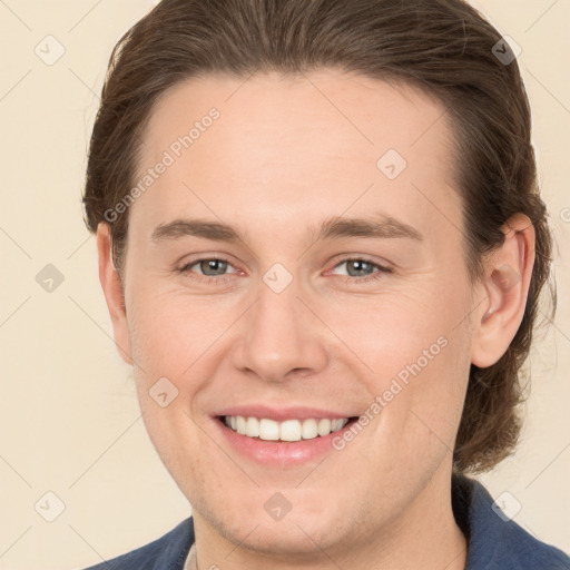 Joyful white young-adult male with medium  brown hair and brown eyes