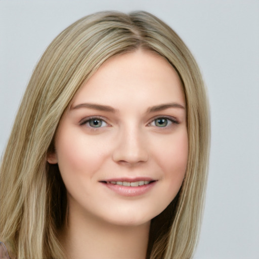 Joyful white young-adult female with long  brown hair and blue eyes