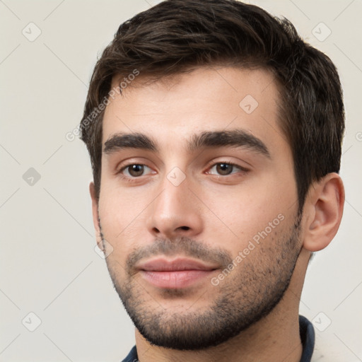 Neutral white young-adult male with short  brown hair and brown eyes