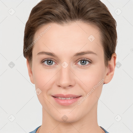 Joyful white young-adult female with short  brown hair and grey eyes