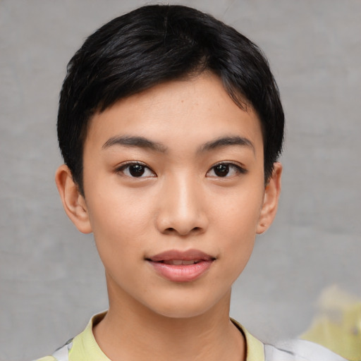 Joyful asian young-adult female with short  black hair and brown eyes
