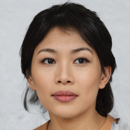 Joyful asian young-adult female with medium  black hair and brown eyes