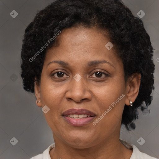 Joyful latino adult female with short  brown hair and brown eyes