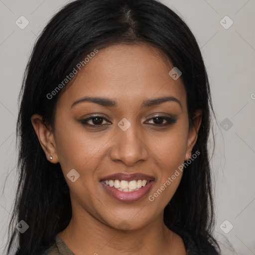 Joyful black young-adult female with long  brown hair and brown eyes