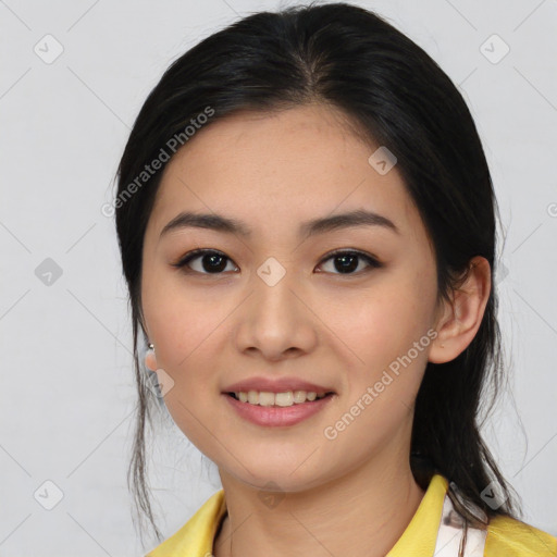 Joyful asian young-adult female with medium  black hair and brown eyes