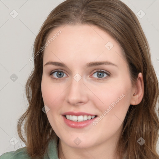 Joyful white young-adult female with long  brown hair and blue eyes