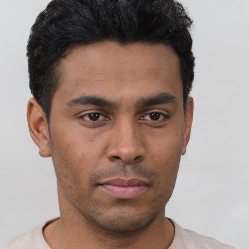 Neutral latino young-adult male with short  black hair and brown eyes