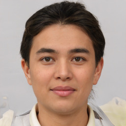 Joyful asian young-adult male with short  brown hair and brown eyes