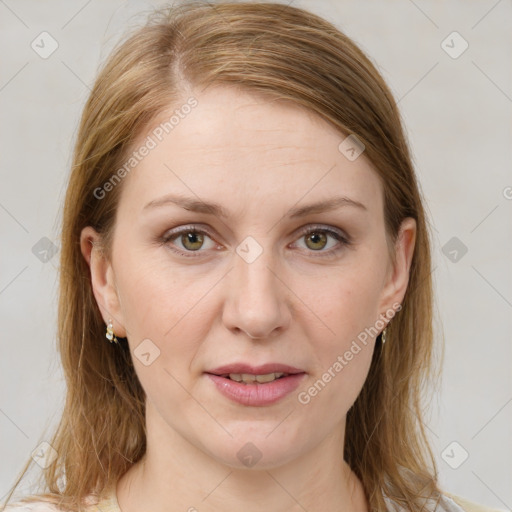 Joyful white young-adult female with medium  brown hair and green eyes