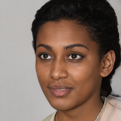 Neutral latino young-adult female with short  black hair and brown eyes