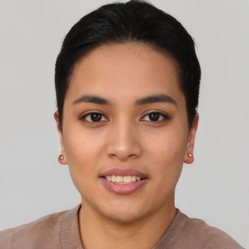 Joyful asian young-adult female with short  black hair and brown eyes