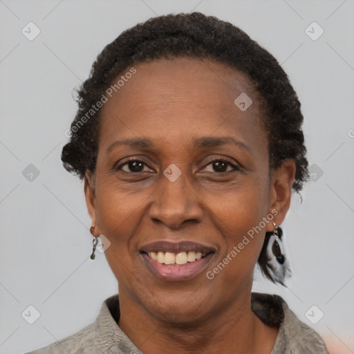 Joyful black adult female with short  brown hair and brown eyes